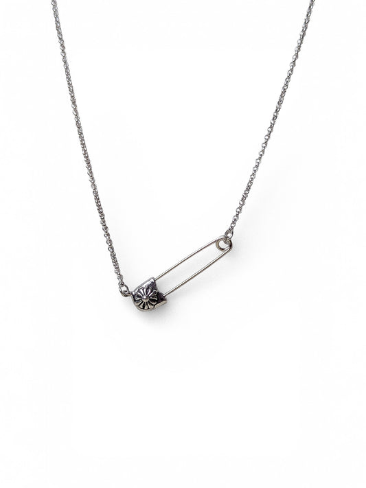 Silver safety pin pendant necklace with daisy floral charm on dual stainless steel layered chains